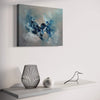Abstract landscape painting titled "Evening Breeze" hung on a white wall above a minimal decor display