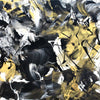 Vibrant abstract art canvas with bold black, white, and golden brushstrokes