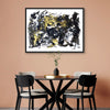 Large abstract painting with bold black and yellow strokes displayed in a modern dining room setting.
