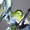 Vibrant abstract painting with dynamic brush strokes in shades of blue, green, and white. The composition features a swirling, organic pattern that creates a sense of movement and energy. The artwork has a contemporary, artistic feel and would make an eye-catching addition to any modern decor.