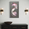 Abstract painting on a gray wall above a black console table with a bowl.