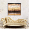 Textured abstract painting depicting a skyline with earthy tones, displayed on a wall above a vintage, ornate ivory-colored chaise lounge.