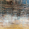 Textured abstract art canvas with layered patterns in earthy tones of brown, gray, and blue.