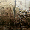 Abstract textured artwork with intricate patterns and layers of earth-toned colors