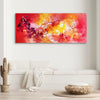 Vibrant abstract canvas art depicting a fiery, dynamic landscape with bold strokes of red, orange, and yellow. The painting creates a sense of energy and movement, making it an eye-catching focal point in this modern living space.