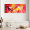 Vibrant abstract canvas art depicting a fiery, dynamic landscape with bold strokes of red, orange, and yellow. The painting creates a sense of energy and movement, making it an eye-catching focal point in this modern living space.