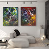 Vibrant Abstract Artwork | Two large abstract paintings in earthy tones and bold colors adorn the modern living room, adding visual interest and warmth to the minimalist space.