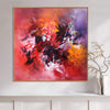 Vibrant abstract canvas art depicting dynamic brushstrokes of warm, fiery colors against a dramatic purple background. Captivating modern art piece suitable for home or office decor.