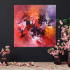 Vibrant Abstract Canvas Art | Fiery Explosion of Colors - 36x36" Painting on display with pink floral arrangements accentuating the dynamic abstract artwork.