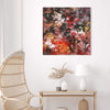 Large abstract painting in earthy colors on wall art
Large abstract square canvas painting with vibrant brown, orange, and red tones displayed on the wall in a minimalist living room setting with a rattan chair and wooden console table.