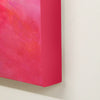 Vibrant pink abstract canvas art with vivid brushstrokes depicting a modern, expressive painting