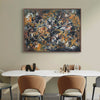 Large abstract portrait artwork in earthy, warm colors displayed on a wall above a white dining table with chairs in a minimalist, modern interior setting.