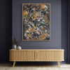 Vibrant abstract canvas art with earthy hues and textured brushstrokes, mounted on a dark gray wall above a wooden sideboard, creating a modern and artistic home decor setting.
