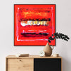 Abstract geometric art | Vibrant red and orange abstract painting depicting a secret path, displayed on a wooden cabinet with decorative items
