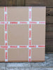 Fragile boxes surrounded by wooden planks in an image