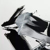 Black and white abstract artwork with dynamic brush strokes and splashes