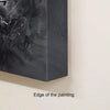 Monochrome abstract artwork depicting powerful, expressive brush strokes in shades of black and grey on a large canvas.