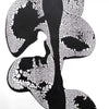 Monochrome abstract art depicting organic, irregular shapes and patterns. The artwork appears to be a high-contrast, textured composition with prominent black and white elements. The image showcases an expressive, minimalist style that evokes a sense of dynamism and movement.