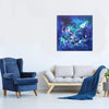 Blue and green abstract canvas art titled "Lost In The Stars" hanging on a white wall in a modern living room setting with a blue velvet armchair and a gray sofa.