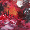 Vibrant abstract art canvas with bold brushstrokes of red, orange, and black paint creating a dynamic and expressive modern landscape scene.