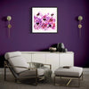 "Spring Blossom" Signed Edition Art Print - Vibrant abstract artwork in pink and purple hues, framed and displayed on a bold purple wall in a modern living room setting with neutral-toned furniture.