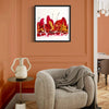 Vibrant abstract artwork "Scarlett Cascade" in a modern home decor setting with a cozy gray armchair and soft furnishings.